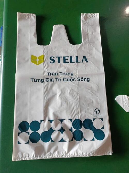 Túi siêu thị tay giữa sản xuất riêng chất liệu và in trục ống đồng